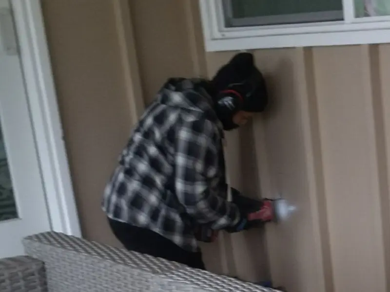 Professional electrician installing an exterior outlet in King City